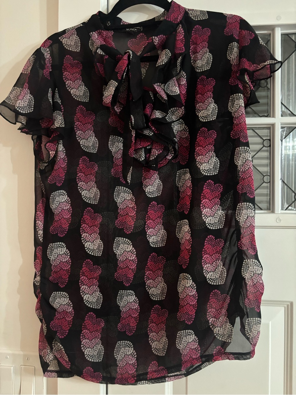 XOXO Black Sheer Ruffle Tie-Neck Blouse with Pink & White Motif